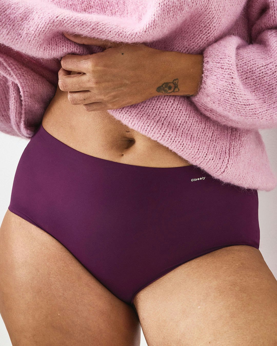 Woman in purple high waist briefs